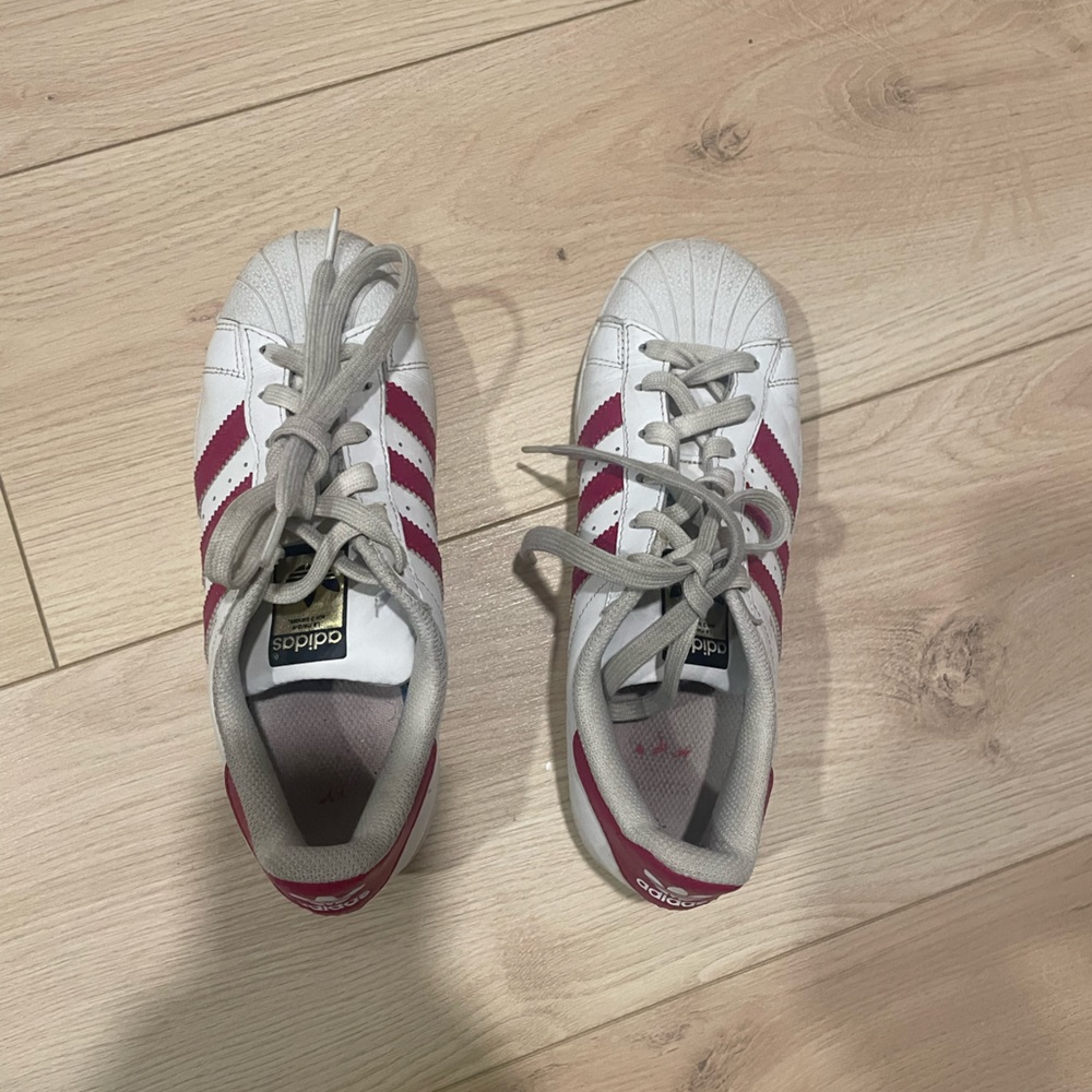 Pink striped adidas shoes